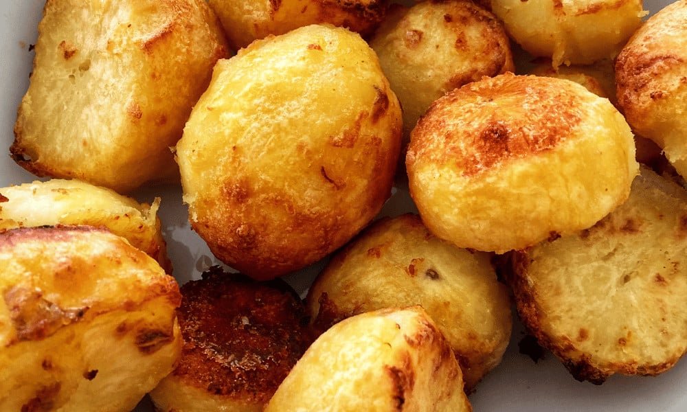 Super crispy roast potatoes piled on top of each other