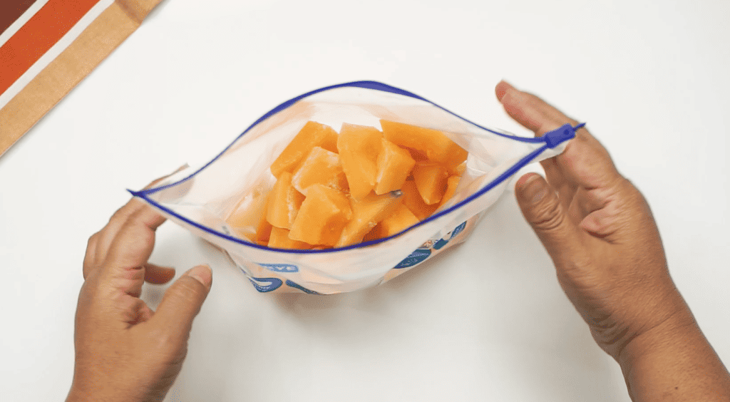 Sealing a Bag of Melon for the Freezer